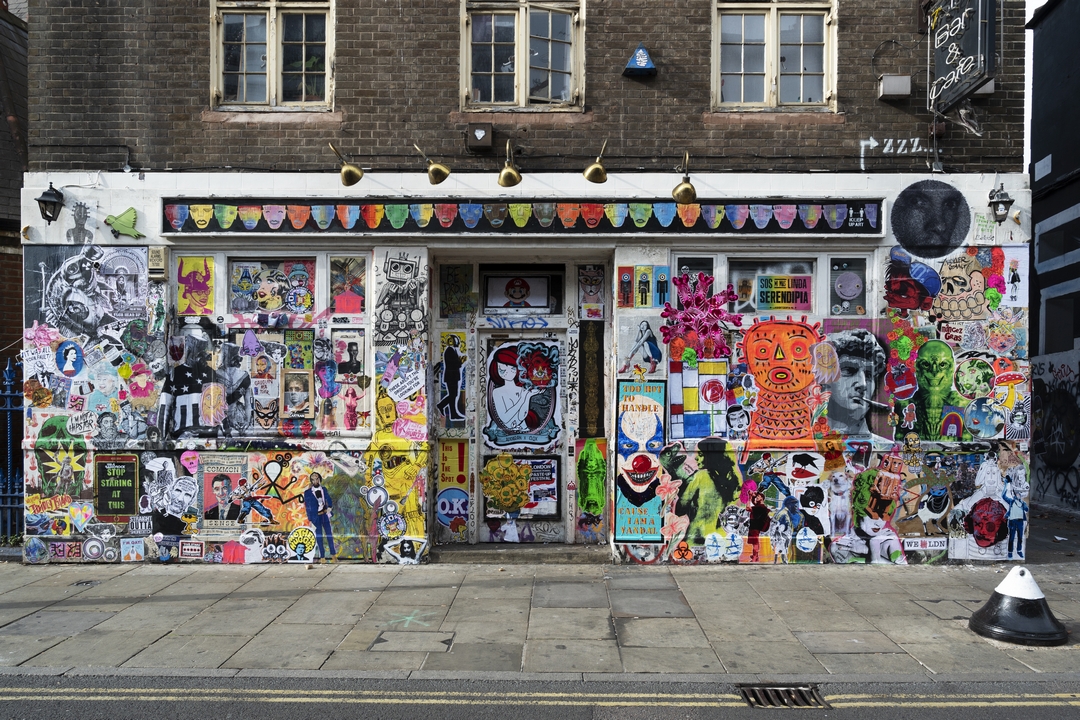 Artists from all over he world participating in the outdoor Paste up Art Festival on Brick Lane, October 202